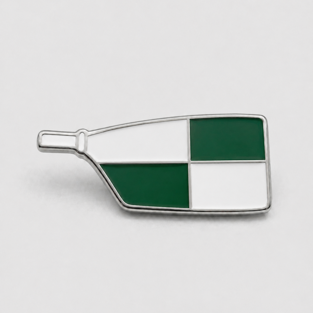 Custom enamel club pin worn on a navy blazer lapel