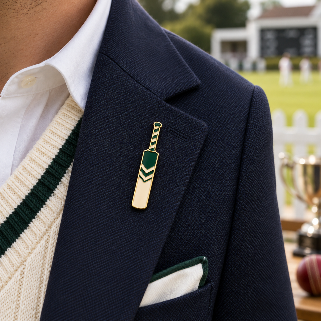 Custom cricket club pin shown at approximately 5cm on a navy blazer