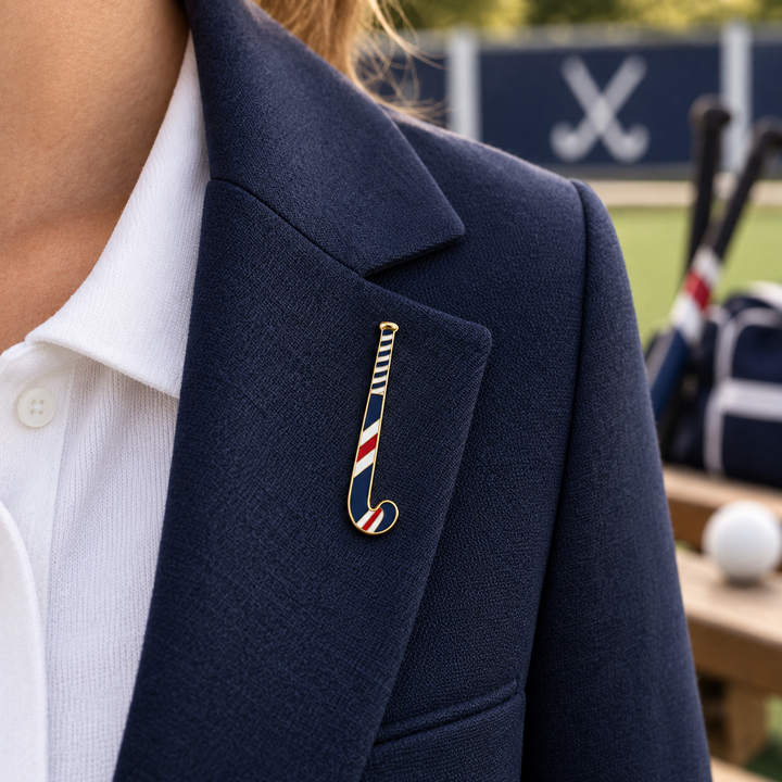 Custom field hockey stick pin shown at approximately 5cm on a navy blazer