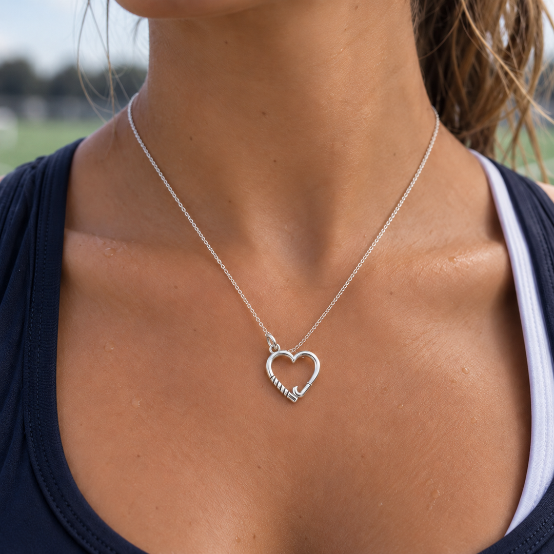 Sterling silver Field Hockey Heart Necklace worn by a hockey player