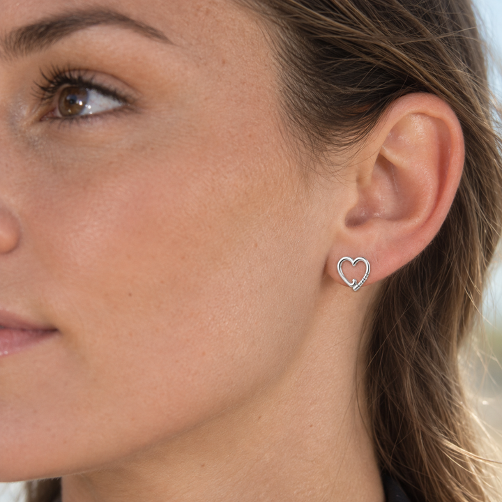Sterling silver Field Hockey Heart Stud Earring worn on ear