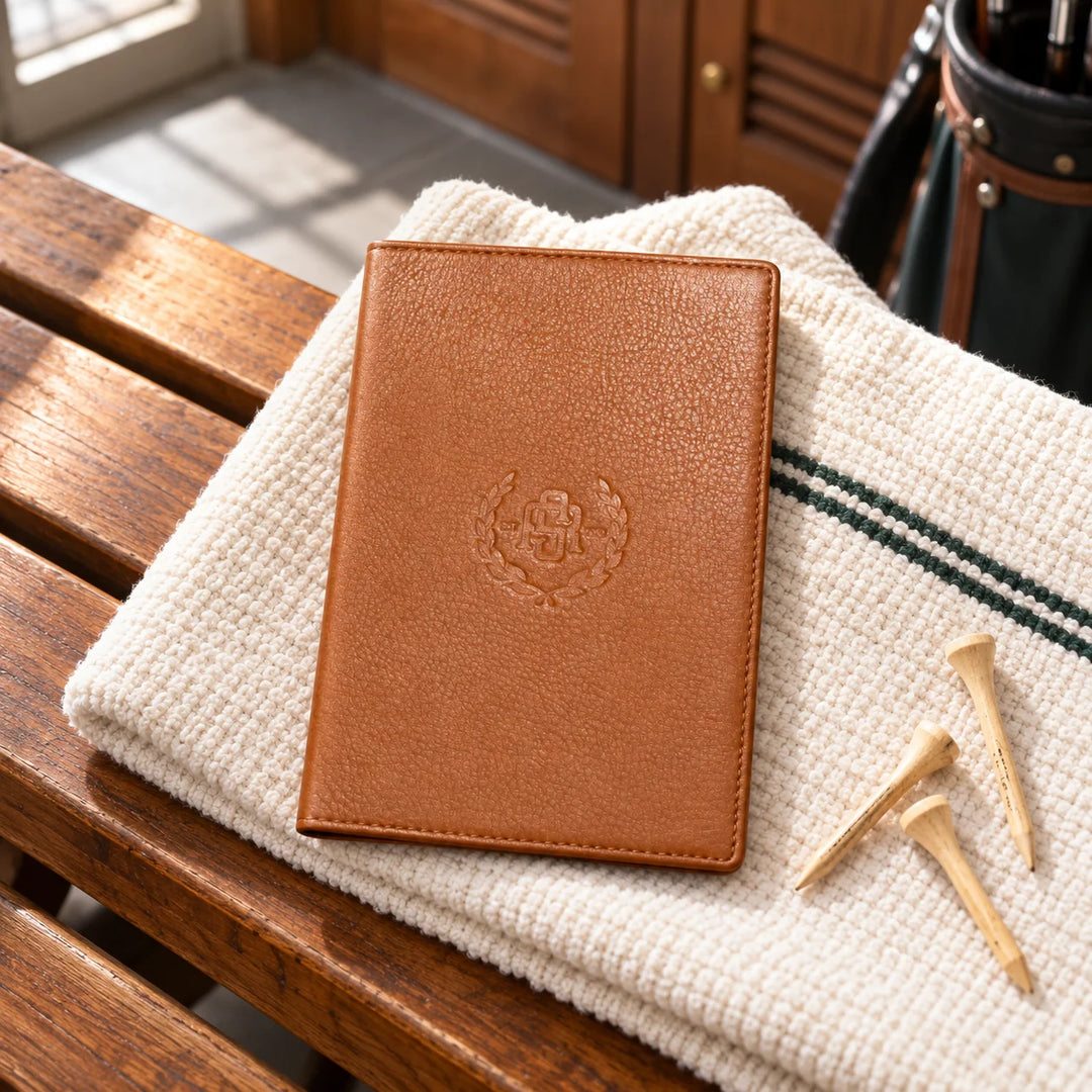 Cognac leather golf scorecard holder in a realistic golf setting