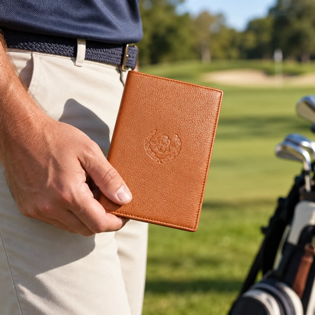 Cognac leather golf scorecard holder in a realistic golf setting