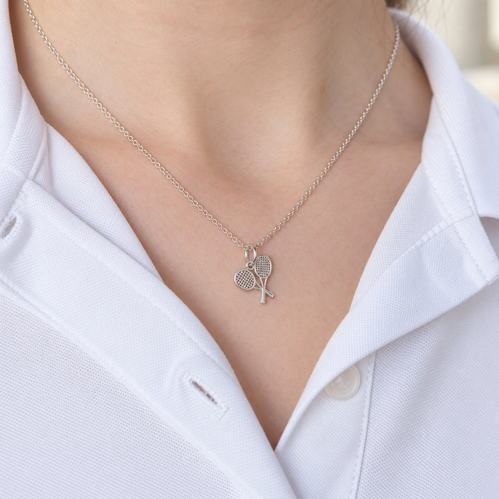 Tennis Double Rackets Pendant worn in natural daylight – with-chain option