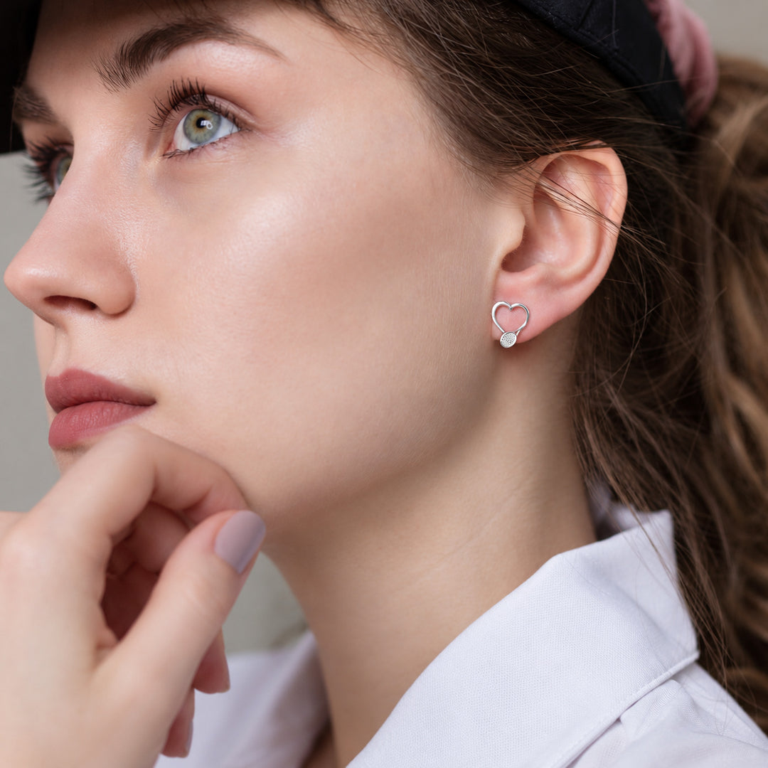 Tennis Racket Stud Earrings worn in natural daylight